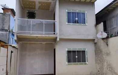 Imagem: A casa possui 3 Dormitórios, 2 Banheiros, 3 Vagas na garagem