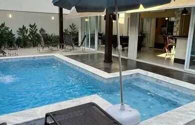 Imagem: A casa em condomínio possui 4 Dormitórios, 5 Banheiros, 4