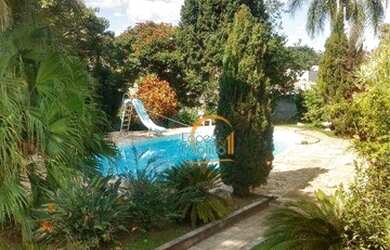 Imagem: A casa possui 5 Dormitórios, 5 Banheiros, 5 Vagas na garagem