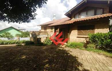 Imagem: A casa possui 3 Dormitórios, 2 Banheiros, 3 Vagas na garagem