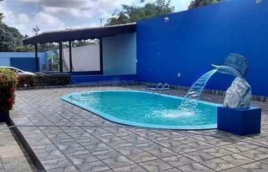 Imagem: A casa possui 3 Dormitórios, 5 Vagas na garagem e está localizado