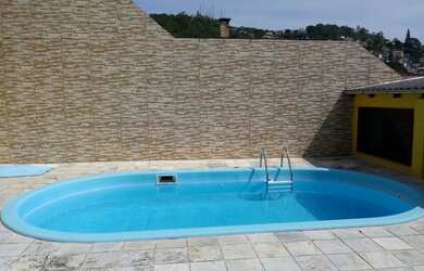 Imagem: A casa possui 5 Dormitórios, 5 Banheiros, 2 Vagas na garagem