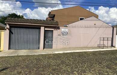 Imagem: A casa possui 3 Dormitórios, 2 Banheiros, 2 Vagas na garagem