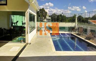 Imagem: A casa em condomínio possui 4 Dormitórios, 4 Banheiros, 2