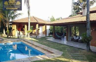 Imagem: A casa em condomínio possui 5 Dormitórios, 5 Banheiros, 4