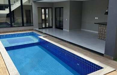 Imagem: A casa em condomínio possui 4 Dormitórios, 5 Banheiros, 5