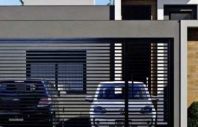 Imagem: A casa possui 3 Dormitórios, 2 Banheiros, 2 Vagas na garagem