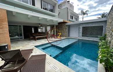 Imagem: A casa em condomínio possui 5 Dormitórios, 5 Banheiros, 2