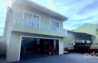 Imagem: A casa possui 2 Dormitórios, 3 Banheiros, 4 Vagas na garagem