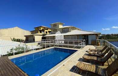 Imagem: A casa possui 5 Dormitórios, 5 Banheiros, 4 Vagas na garagem