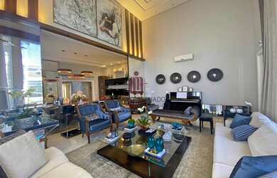 Imagem: A casa possui 4 Dormitórios, 5 Banheiros, 4 Vagas na garagem