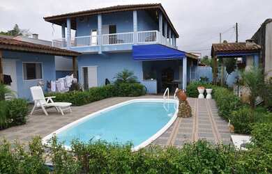 Imagem: A casa possui 4 Dormitórios, 4 Banheiros, 1 Vaga na garagem