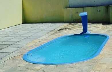 Imagem: A casa possui 3 Dormitórios, 3 Banheiros e 2 Vagas na garagem