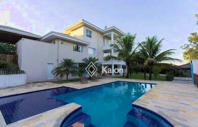 Imagem: A casa em condomínio à venda possui 5 Dormitórios, 5 Banheiros