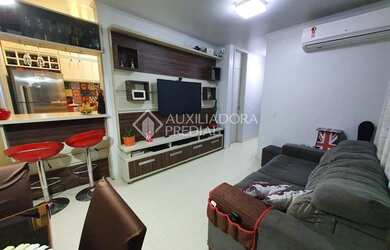 Imagem: O apartamento possui 3 Dormitórios, 1 Banheiro, 1 Vaga na garagem