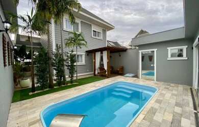 Imagem: A casa possui 3 Dormitórios, 4 Banheiros, 4 Vagas na garagem