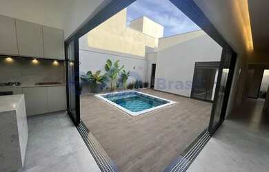 Imagem: A casa possui 3 Dormitórios, 5 Banheiros, 4 Vagas na garagem