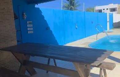 Imagem: A casa possui 3 Dormitórios, 3 Banheiros, 4 Vagas na garagem