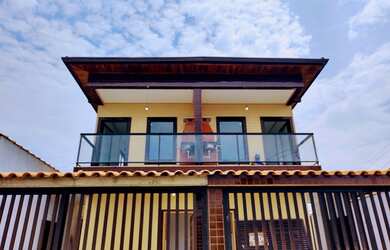 Imagem: A casa possui 2 Dormitórios, 3 Banheiros, 1 Vaga na garagem