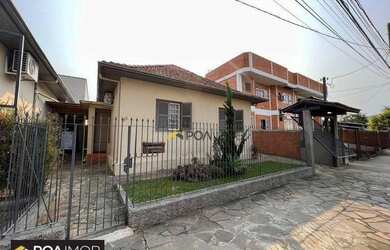 Imagem: A casa e possui 3 Dormitórios, Suítes, 2 Banheiros, 2 Vagas