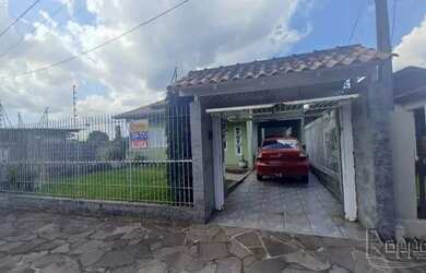 Imagem: A casa e possui 3 Dormitórios, Suítes, 2 Banheiros, 4 Vagas