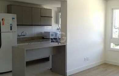 Imagem: O apartamento possui 1 Dormitório, 1 Banheiro, 1 Vaga na garagem