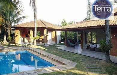 Imagem: A casa em condomínio possui 5 Dormitórios, 5 Banheiros, 4