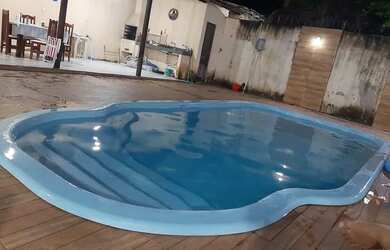 Imagem: A casa possui 3 Dormitórios, 3 Vagas na garagem e está localizado