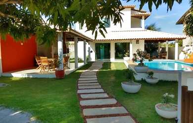 Imagem: A casa possui 3 Dormitórios, 4 Vagas na garagem e está localizado