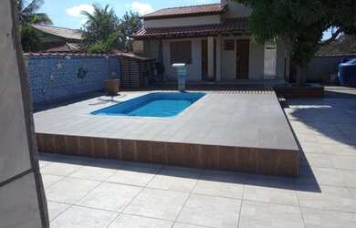 Imagem: A casa possui 2 Dormitórios, 3 Banheiros, 5 Vagas na garagem