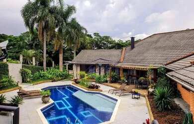 Imagem: A casa em condomínio possui 5 Dormitórios, 5 Banheiros, 5