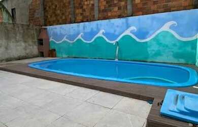 Imagem: A casa possui 2 Dormitórios, 4 Vagas na garagem e está localizado