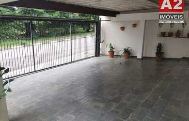 Imagem: A casa possui 3 Dormitórios, 5 Banheiros, 3 Vagas na garagem