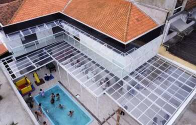 Imagem: A casa possui 5 Dormitórios, 5 Banheiros, 5 Vagas na garagem