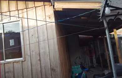 Imagem: A casa possui 2 Dormitórios, 2 Vagas na garagem, 36m² de Área