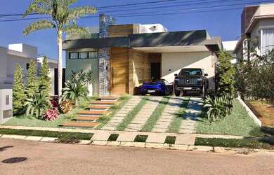 Imagem: A casa possui 3 Dormitórios, 4 Banheiros, 5 Vagas na garagem