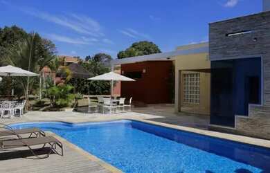 Imagem: A casa possui 5 Dormitórios, 5 Vagas na garagem e está localizado