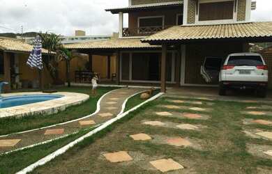 Imagem: A casa possui 5 Dormitórios, 5 Banheiros, 5 Vagas na garagem