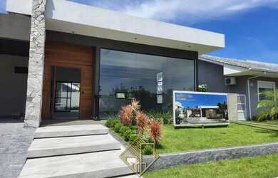 Imagem: A casa possui 3 Dormitórios, 4 Banheiros, 4 Vagas na garagem