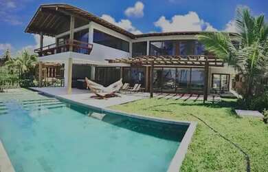 Imagem: A casa em condomínio possui 5 Dormitórios, 5 Banheiros, 2