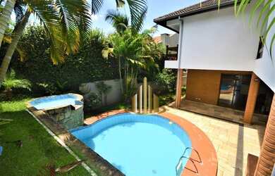 Imagem: A casa em condomínio possui 4 Dormitórios, 5 Banheiros, 4