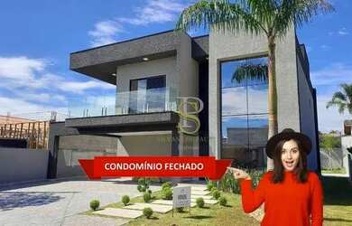 Imagem: A casa em condomínio possui 4 Dormitórios, 5 Banheiros, 2