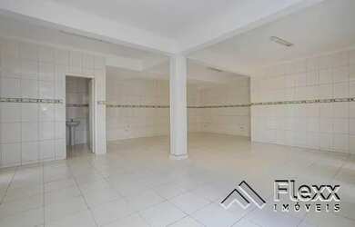 Imagem: A casa possui 3 Dormitórios, 4 Banheiros, 5 Vagas na garagem