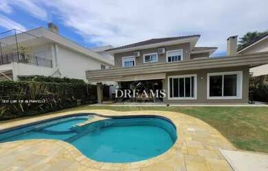 Imagem: A casa em condomínio possui 4 Dormitórios, 5 Banheiros, 4