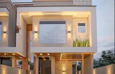 Imagem: A casa possui 3 Dormitórios, 2 Banheiros, 2 Vagas na garagem