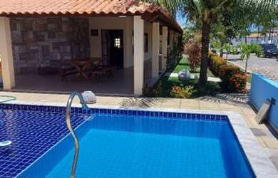 Imagem: A casa possui 4 Dormitórios, 5 Vagas na garagem e está localizado