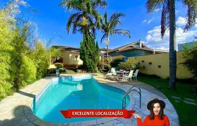 Imagem: A casa possui 4 Dormitórios, 3 Banheiros, 5 Vagas na garagem