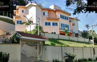 Imagem: A casa possui 5 Dormitórios, 5 Banheiros, 4 Vagas na garagem