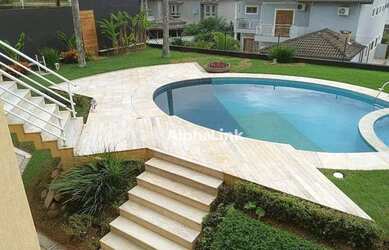 Imagem: A casa em condomínio possui 4 Dormitórios, 5 Banheiros, 4