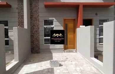 Imagem: A casa possui 2 Dormitórios, 2 Banheiros, 1 Vaga na garagem